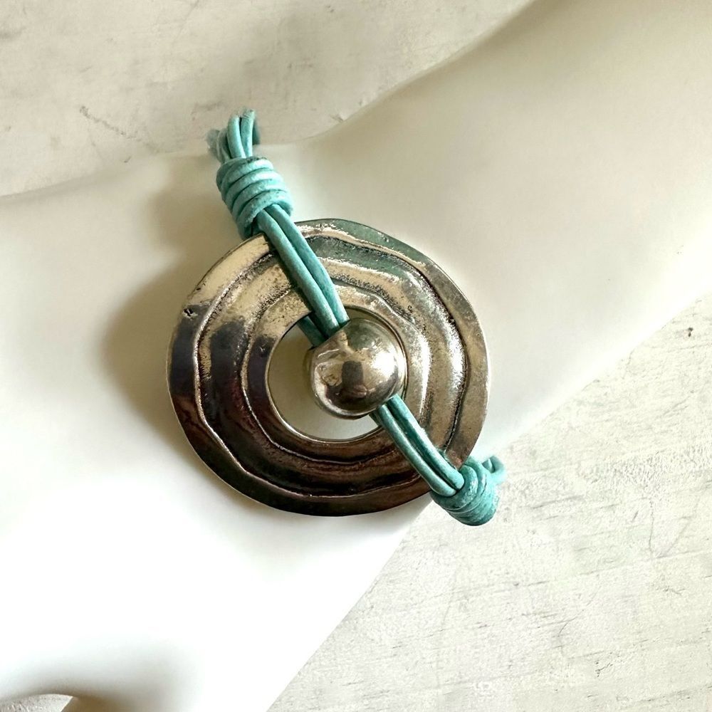 Silver tone blue cord bracelet